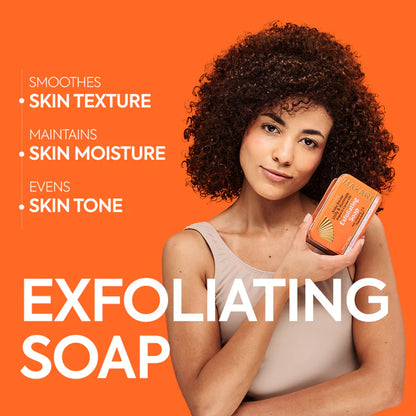 Woman holding an exfoliating soap bar with product benefits on an orange background | Makari de Suisse Uganda